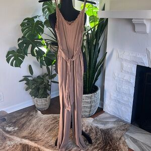 Never worn. Summer fun jumpsuit! XS